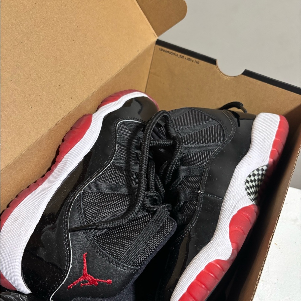 Jordan 11 Retro Black and Red Sneakers